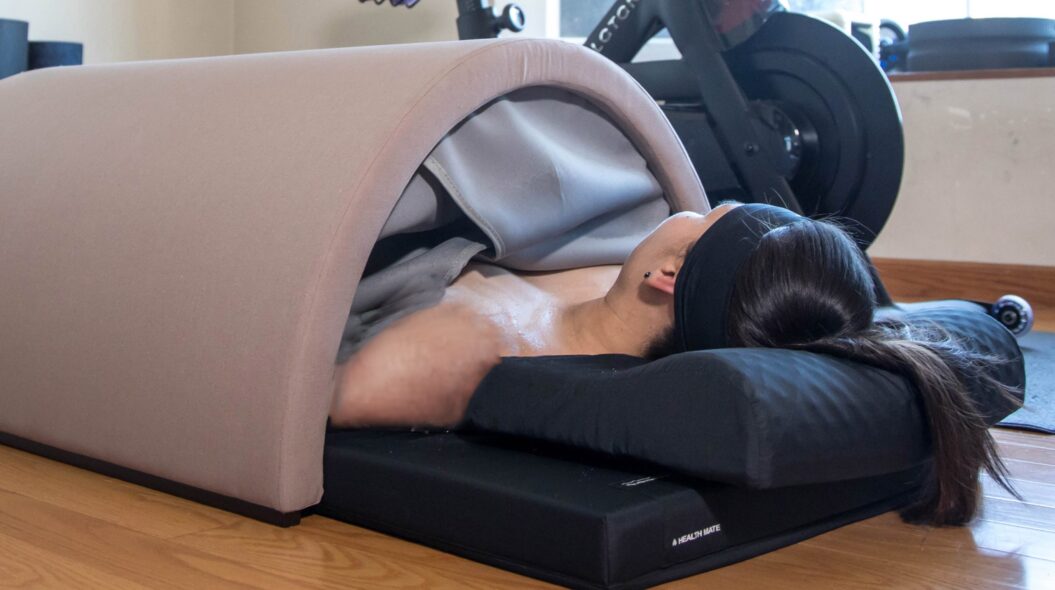 woman relaxing in Essential Comfort sauna