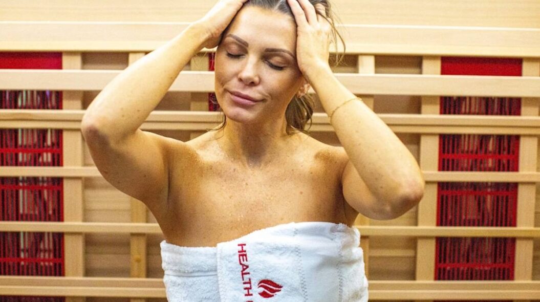 Woman detoxing in towel in Inspire 3 sauna