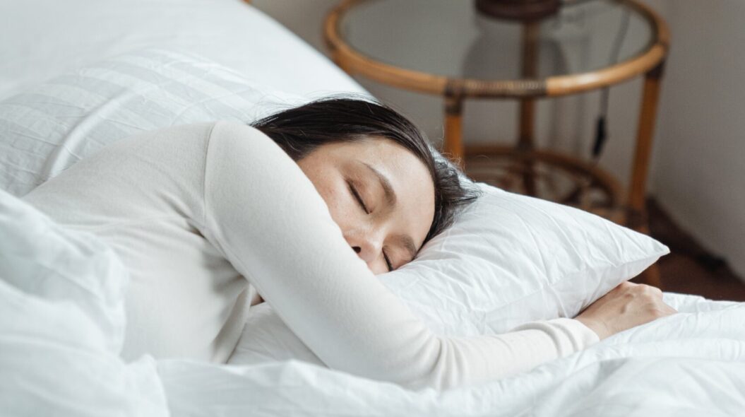 woman fast asleep in bed